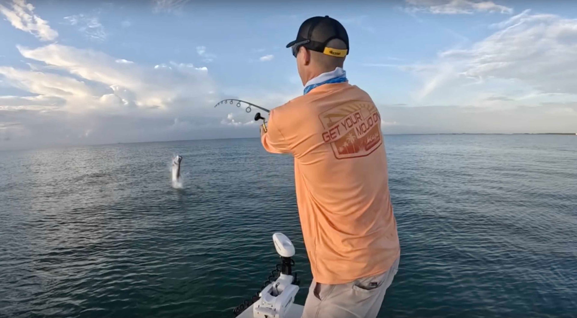 Load video: MSC Pro-Staffer Jon Lulay reeling in a giant fish while wearing RBW Sunset Shield Wireman X in Sailor Sunset color